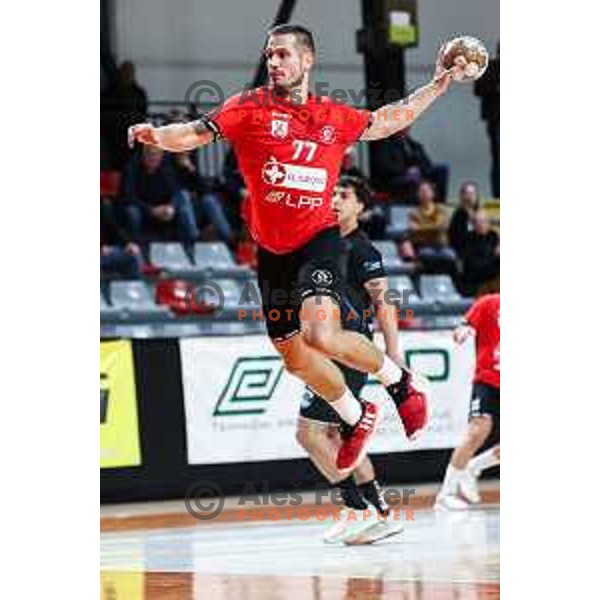 Gasper Hrastnik in action during 1.NLB League handball match between LL Grosist Slovan and Slovenj Gradec in Ljubljana, Slovenia on November 22, 2024