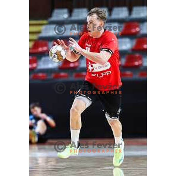 Stas Slatinek Jovicic in action during 1.NLB League handball match between LL Grosist Slovan and Slovenj Gradec in Ljubljana, Slovenia on November 22, 2024