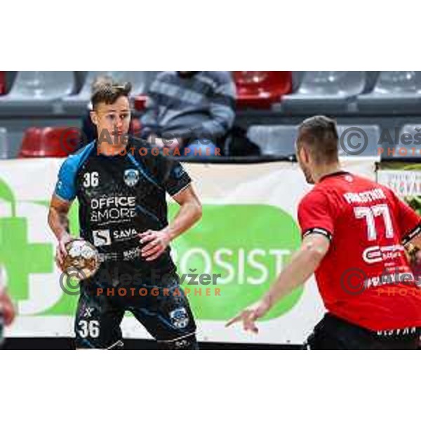 in action during 1.NLB League handball match between LL Grosist Slovan and Slovenj Gradec in Ljubljana, Slovenia on November 22, 2024