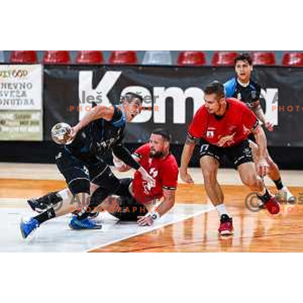 David Svecko in action during 1.NLB League handball match between LL Grosist Slovan and Slovenj Gradec in Ljubljana, Slovenia on November 22, 2024