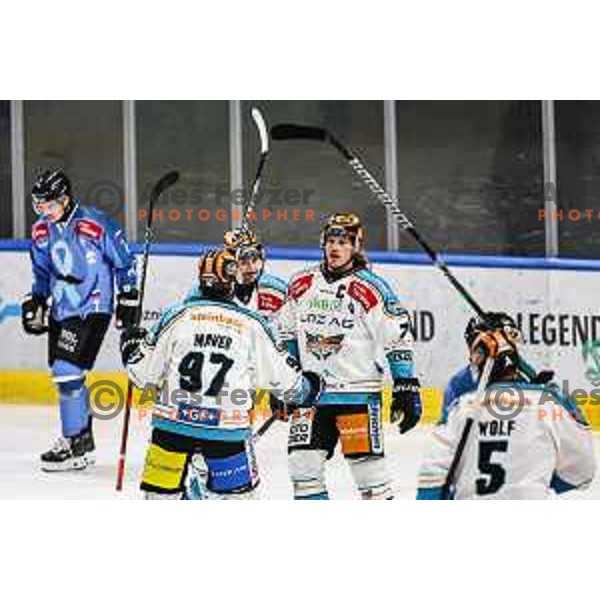 Rok Maver and Brian Lebler celebrate a goal during IceHL match between SZ Olimpija and Black Wings Linz in Ljubljana, Slovenia on November 22, 2024