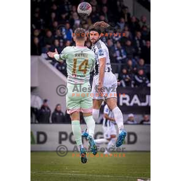 Marcel Ratnik and Steven George Juncaj in action during Prva liga Telemach 2024/2025 football match between Mura and Olimpija in Mestni stadion Fazanerija, Murska Sobota, Slovenia on November 24th, 2024 Photo: Sebastijan Andrejek Bukovec