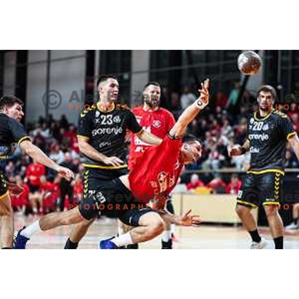 in action during 1.NLB League handball match between LL Grosist Slovan and Gorenje Velenje in Ljubljana, Slovenia on November 30, 2024