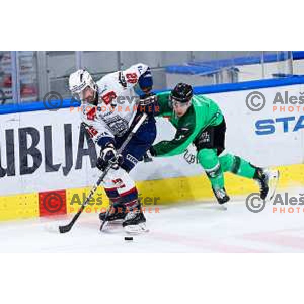 Balint Magosi of Hydro Fehervar AV19 and Marcel Mahkovec of SZ Olimpija in action during IceHL hockey match between SZ Olimpija and Hydro Fehervar AV19 in Ljubljana, Slovenia on Decemeber 22, 2024. Photo: Filip Barbalic
