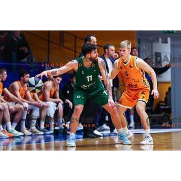 Tayler Persons and Jon Dolnicar in action during OTP Bank League 2024/2025 basketball match between Kansai Helios and Krka in Domzale, Slovenia on January 2, 2024