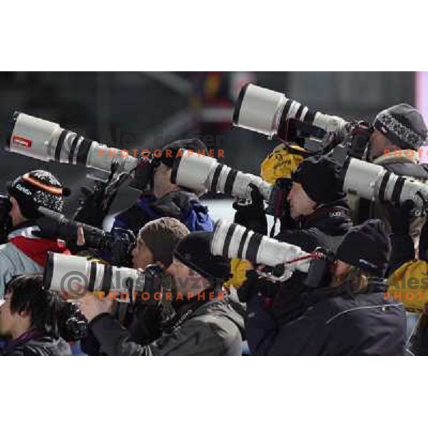 Photographers shooting at 120 m individual ski jumping event in Pragelato at Torino 2006 Winter Olympic games, Italy on February 18, 2006