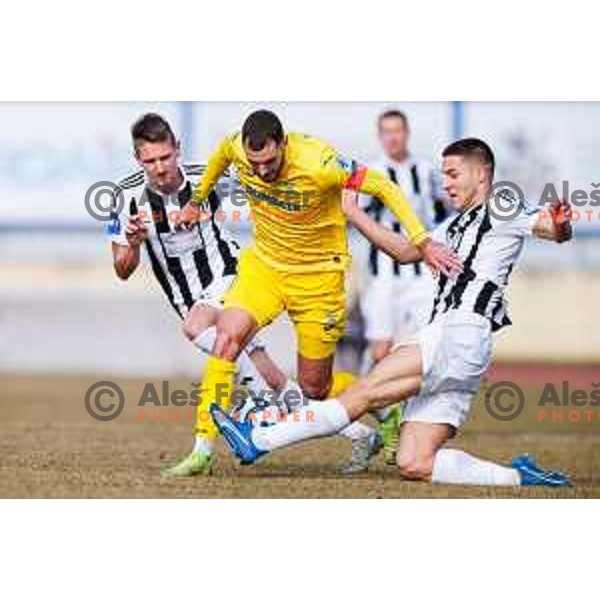 Danijel Sturm and Massimo Decoene in action during Prva liga Telemach 2024/2025 football match between Domzale and Mura in Domzale on February 8, 2025