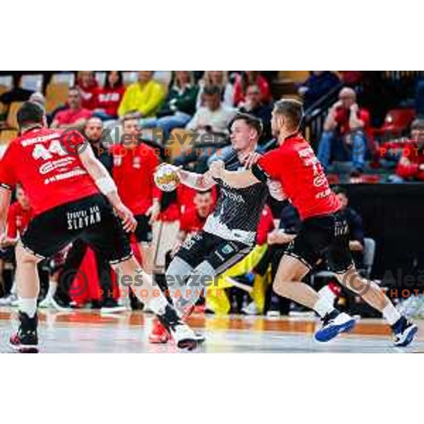 Nik Cirovic and Gasper Hrastnik in action during 1.NLB League handball match between LL Grosist Slovan and MRK Krka in Ljubljana, Slovenia on February 11, 2025