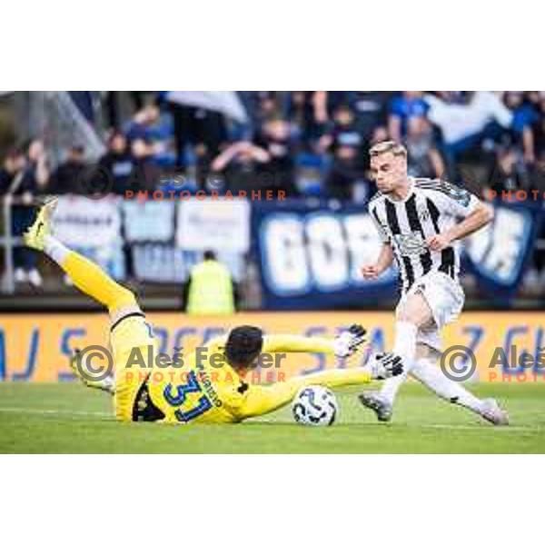 Zan Mauricio vs Aljaz Antolin in action during Prva liga Telemach football match between Nafta 1903 and Mura in Sportni park Lendava, Slovenia on April 5, 2025. Photo: Jure Banfi