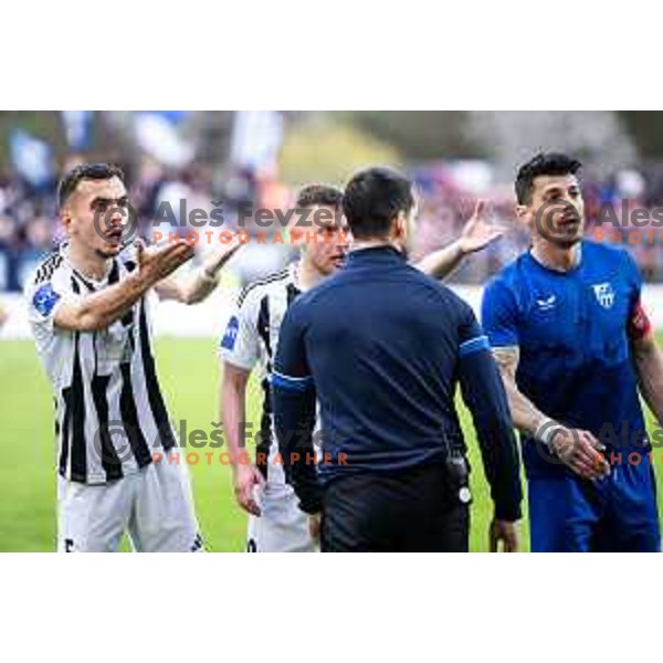 Leard Sadriu and Almir Kurtovic react to VAR observation during Prva liga Telemach football match between Nafta 1903 and Mura in Sportni park Lendava, Slovenia on April 5, 2025. Photo: Jure Banfi