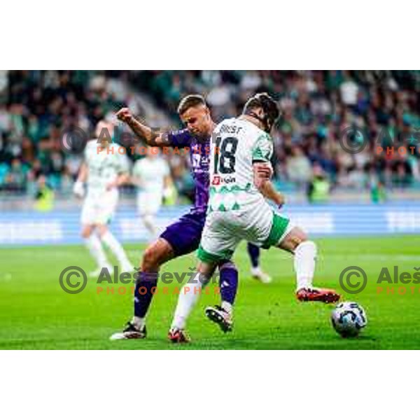 Pijus Sirvys and Marko Brest in action during Prva liga Telemach 2024/2025 football match between Olimpija and Maribor in Ljubljana, Slovenia on May 3, 2025