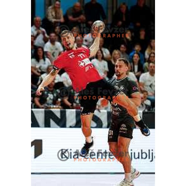 Gasper Hrastnik of RD LL Grosist Slovan in action during First match of Semi-finals of NLB League 2024/2025 between LL Grosist Slovan and Trimo Trebnje in Kodeljevo Hall, Ljubljana, Slovenia on May 17, 2025.