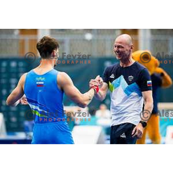 Beno Kunst of Slovenia with coach during finals day at 19. FIG Art World Challange Cup in Koper, on May 18., 2025, Slovenia Photo: Grega Valancic