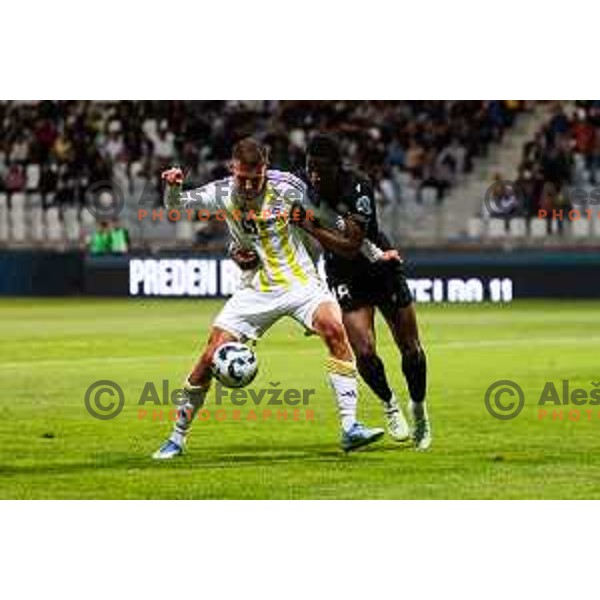 Pijus Sirvys of NK Maribor and Ahmed Franck Sidibe of FC Koper in action during Prva liga Telemach 2024/2025 football match between Koper and Maribor in Koper, Slovenia on May 18, 2025 Photo: Grega Valancic