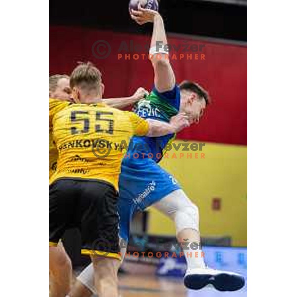 in action during second 1.NLB league semi-final handball match between Gorenje Velenje and Celje Pivovarna Lasko in Velenje, Slovenia on May 21, 2025.