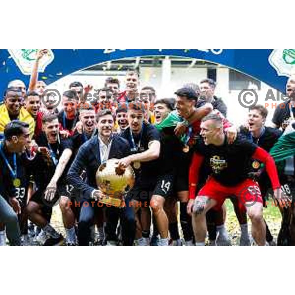 Head coach Victor Sanchez, Marcel Ratnik, Matevz Vidovsek and players of Olimpija celebrate Slovenian National Title after the Prva liga Telemach 2024/2025 football match between Bravo and Olimpija in Ljubljana, Slovenia on May 24, 2025