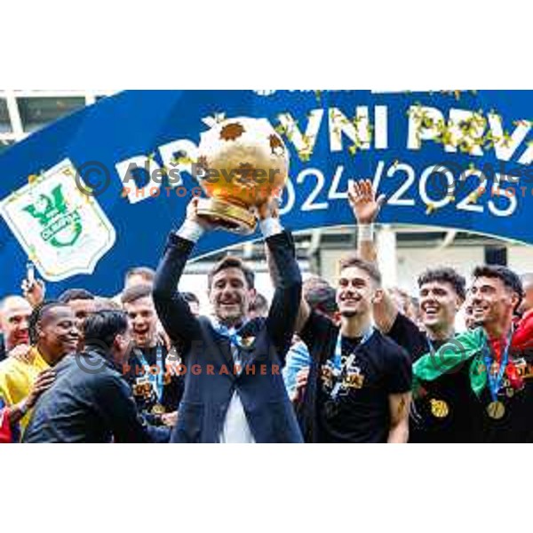 Head coach Victor Sanchez, Marcel Ratnik, Matevz Vidovsek and players of Olimpija celebrate Slovenian National Title after the Prva liga Telemach 2024/2025 football match between Bravo and Olimpija in Ljubljana, Slovenia on May 24, 2025