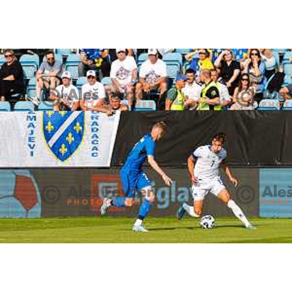 Zan Karnicnik and Amar Dedic in action during international friendly football match between Slovenia and Bosnia and Herzegovina in Celje, Slovenia on June 10, 2025.