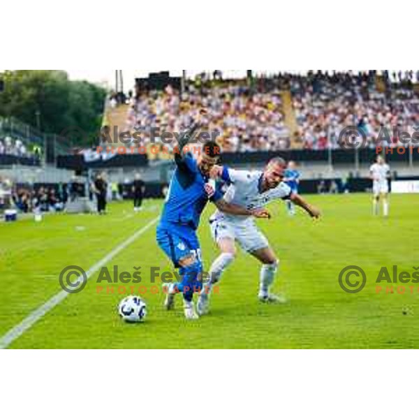 Petar Stojanovic and Nihad Mujakic in action during international friendly football match between Slovenia and Bosnia and Herzegovina in Celje, Slovenia on June 10, 2025