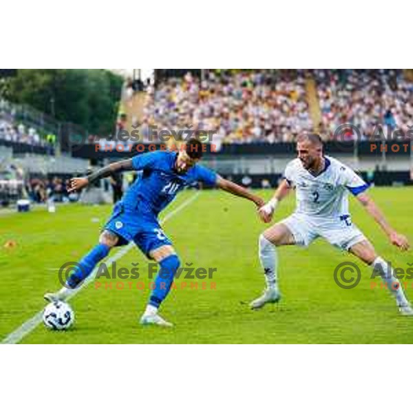 Petar Stojanovic and Nihad Mujakic in action during international friendly football match between Slovenia and Bosnia and Herzegovina in Celje, Slovenia on June 10, 2025