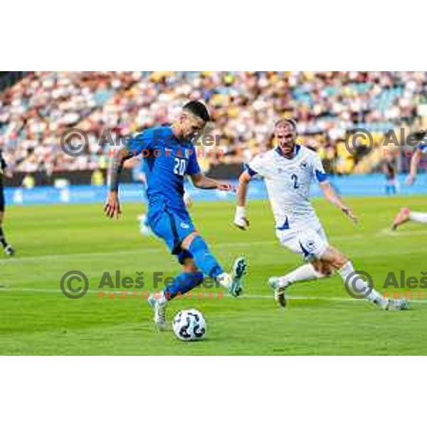 Petar Stojanovic and Nihad Mujakic in action during international friendly football match between Slovenia and Bosnia and Herzegovina in Celje, Slovenia on June 10, 2025