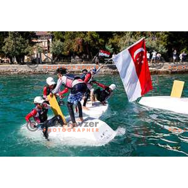 Members of Team Singapore celebrate silver medal in the Team Race Final sailing competition at 2025 Optimist World Championship in Portoroz, Slovenia on July 2, 2025