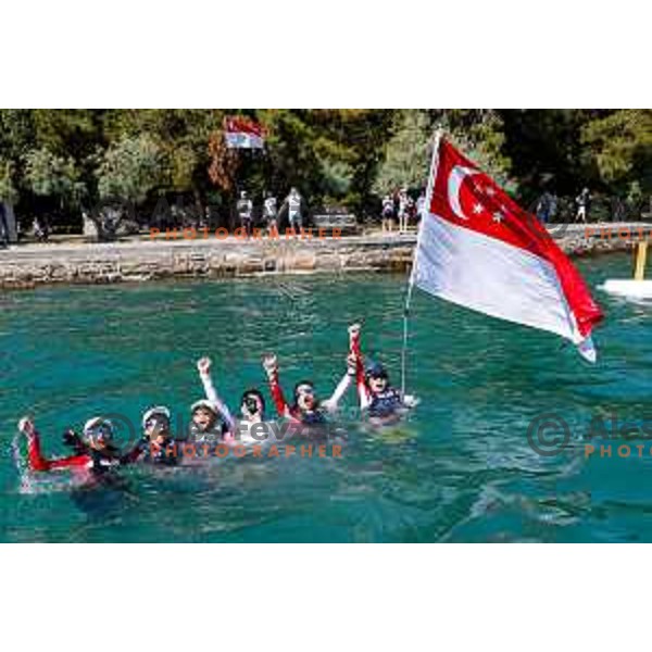 Members of Team Singapore celebrate silver medal in the Team Race Final sailing competition at 2025 Optimist World Championship in Portoroz, Slovenia on July 2, 2025