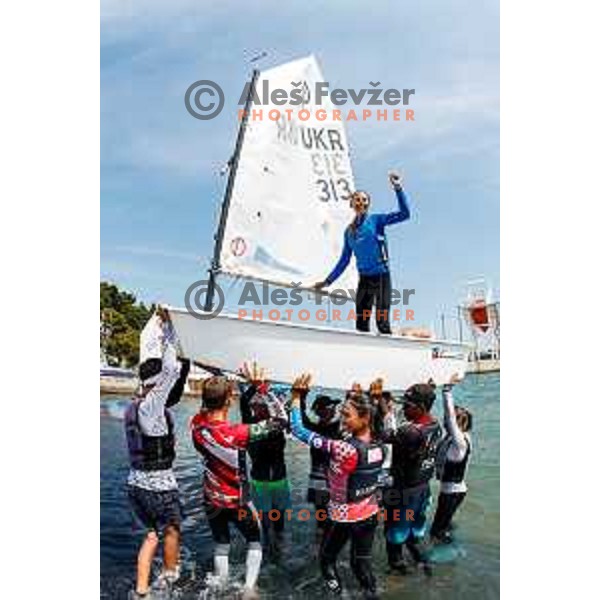 Olha Lubianska (UKR) celebrates golf medal in girls category after Final day of sailing competition at 2025 Optimist World Championship in Portoroz, Slovenia on July 5, 2025