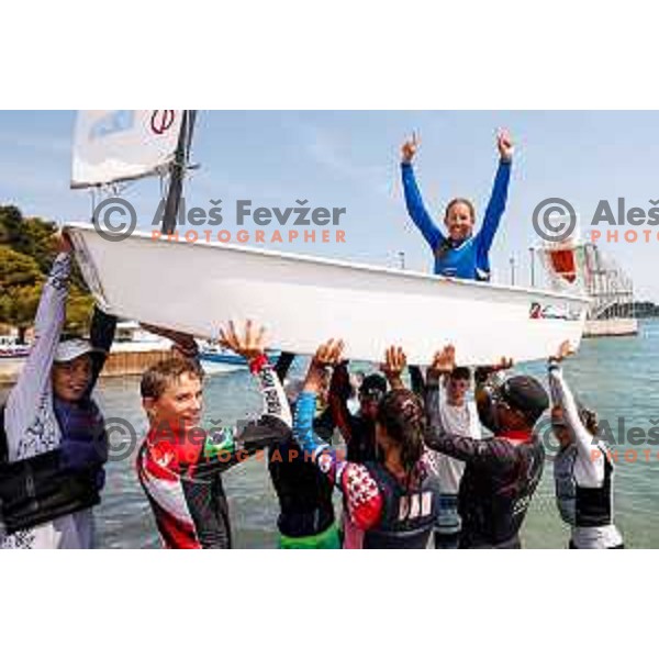 Olha Lubianska (UKR) celebrates golf medal in girls category after Final day of sailing competition at 2025 Optimist World Championship in Portoroz, Slovenia on July 5, 2025