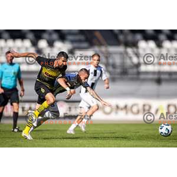 Ognjen Gnjatic vs Dario Vizinger in action during Prva liga Telemach 2025/26 football match between NK Mura and NK Kalcer Radomlje in Fazanerija, Murska Sobota, Slovenia on September 21, 2025. Photo: Jure Banfi