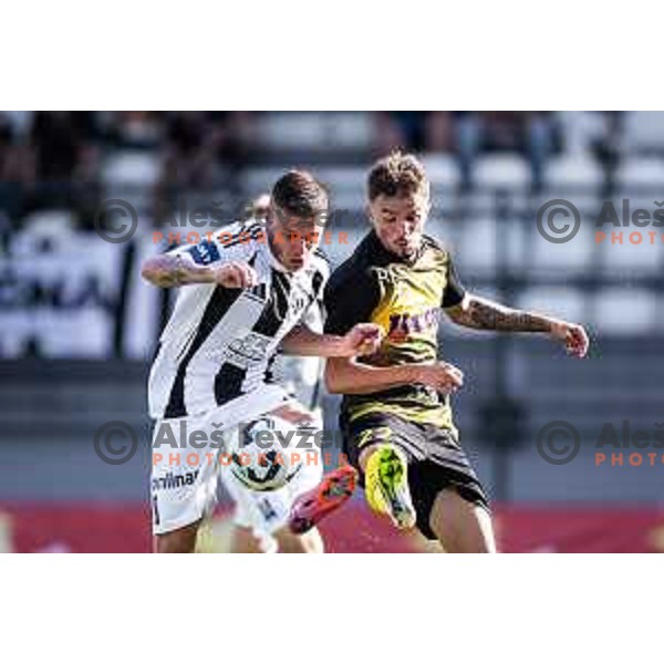 Luka Bobicanec vs Nikola Jojic in action during Prva liga Telemach 2025/26 football match between NK Mura and NK Kalcer Radomlje in Fazanerija, Murska Sobota, Slovenia on September 21, 2025. Photo: Jure Banfi