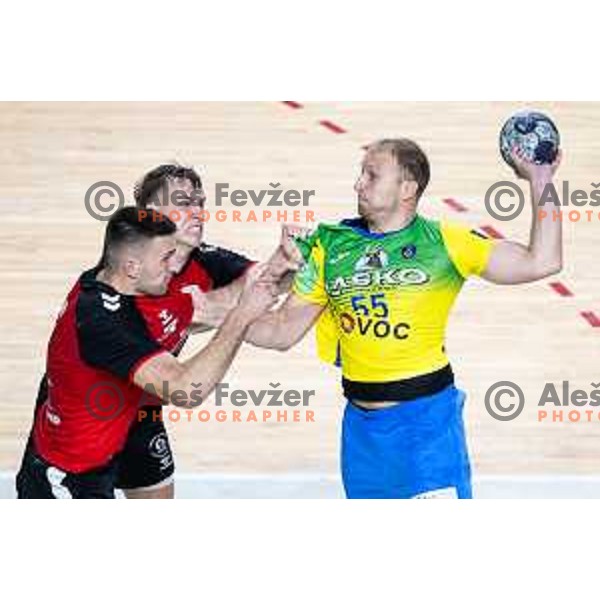 Leon Ljevar vs Ziga Mlakar in action during 1.NLB handball match between RK Celje Pivovarna Lasko and LL Grosist Slovan in Dvorana Zlatorog, Celje, Slovenia on September 26, 2025. Photo: Jure Banfi