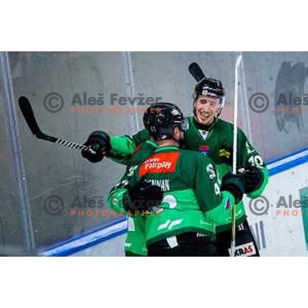 TJ Brennan, Marley Quince and Miha Bericic of SZ Olimpija celebrate goal during IceHL 2025/2026 ice-hockey match between SZ Olimpija and Steinbach Black Wings Linz in Tivoli Hall, Ljubljana, Slovenia on October 10, 2025. Photo: Filip Barbalic