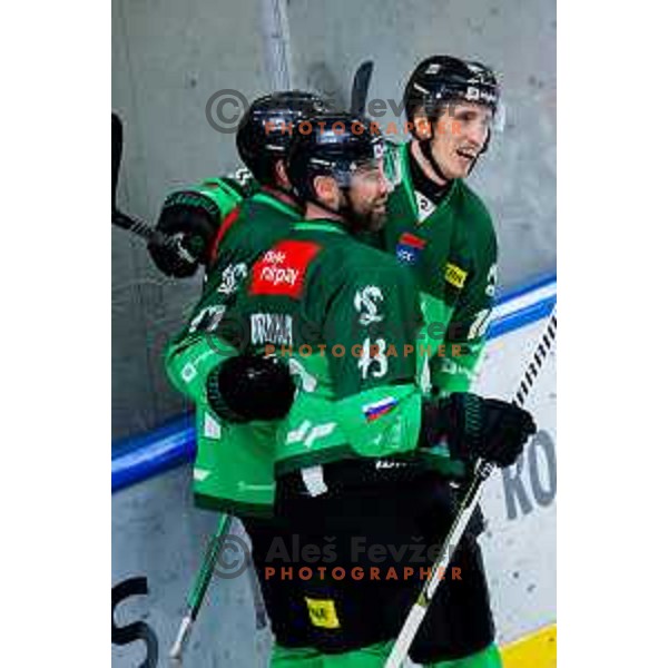 TJ Brennan, Marley Quince and Miha Bericic of SZ Olimpija celebrate goal during IceHL 2025/2026 ice-hockey match between SZ Olimpija and Steinbach Black Wings Linz in Tivoli Hall, Ljubljana, Slovenia on October 10, 2025. Photo: Filip Barbalic