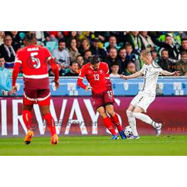 Ricardo Rodriguez and Zan Karnicnik in action during FIFA World Cup 2026 European Qualifiers match between Slovenia and Switzerland in SRC Stozice, Ljubljana, Slovenia on October 13, 2025