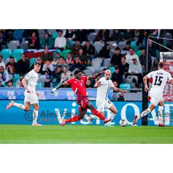 Jaka bijol and Breel Embolo in action during FIFA World Cup 2026 European Qualifiers match between Slovenia and Switzerland in SRC Stozice, Ljubljana, Slovenia on October 13, 2025