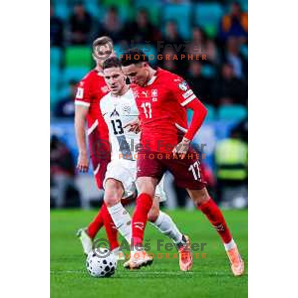 Erik Janza and Ruben Vargas in action during FIFA World Cup 2026 European Qualifiers match between Slovenia and Switzerland in SRC Stozice, Ljubljana, Slovenia on October 13, 2025