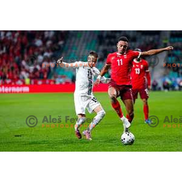 Tomi Horvat and Dan Ndoye in action during FIFA World Cup 2026 European Qualifiers match between Slovenia and Switzerland in SRC Stozice, Ljubljana, Slovenia on October 13, 2025