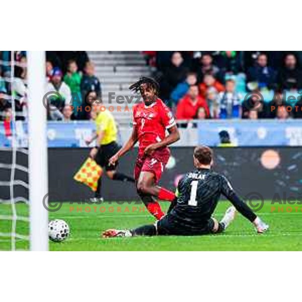 Johan Manzambi and Jan Oblak in action during FIFA World Cup 2026 European Qualifiers match between Slovenia and Switzerland in SRC Stozice, Ljubljana, Slovenia on October 13, 2025