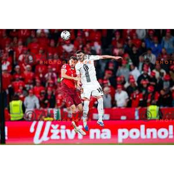 Nico Elvedi and Zan Vipotnik in action during FIFA World Cup 2026 European Qualifiers match between Slovenia and Switzerland in SRC Stozice, Ljubljana, Slovenia on October 13, 2025