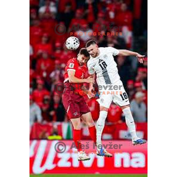 Nico Elvedi and Zan Vipotnik in action during FIFA World Cup 2026 European Qualifiers match between Slovenia and Switzerland in SRC Stozice, Ljubljana, Slovenia on October 13, 2025