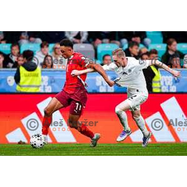 Dan Ndoye and Zan Karnicnik in action during FIFA World Cup 2026 European Qualifiers match between Slovenia and Switzerland in SRC Stozice, Ljubljana, Slovenia on October 13, 2025