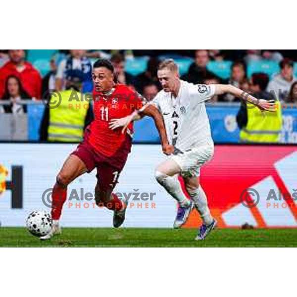 Dan Ndoye and Zan Karnicnik in action during FIFA World Cup 2026 European Qualifiers match between Slovenia and Switzerland in SRC Stozice, Ljubljana, Slovenia on October 13, 2025