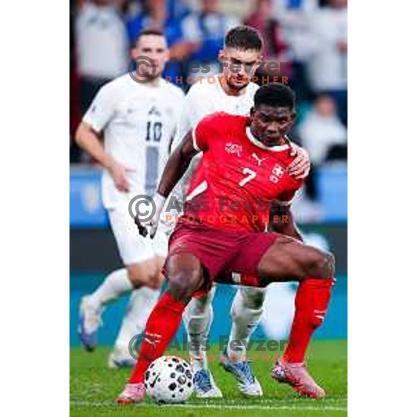 Adam Gnezda Cerin and Breel Embolo in action during FIFA World Cup 2026 European Qualifiers match between Slovenia and Switzerland in SRC Stozice, Ljubljana, Slovenia on October 13, 2025