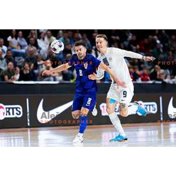 Kristian Cekol of Croatia and Jeremy Bukovec of Slovenia in action during Futsal Friendly match between Slovenia and Croatia in Dvorana Kodeljevo, Ljubljana, Slovenia on October 17, 2025. Photo: Filip Barbalic