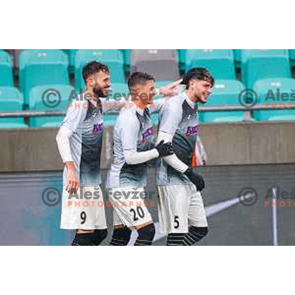 Nino Kukovec, Luka Kusic and Enej Klampfer of Kalcer Radomlje celebrate a goal during Prva liga Telemach 2025/2026 football match between Bravo Big Bang and Kalcer Radomlje in Ljubljana, Slovenia on November 24, 2025
