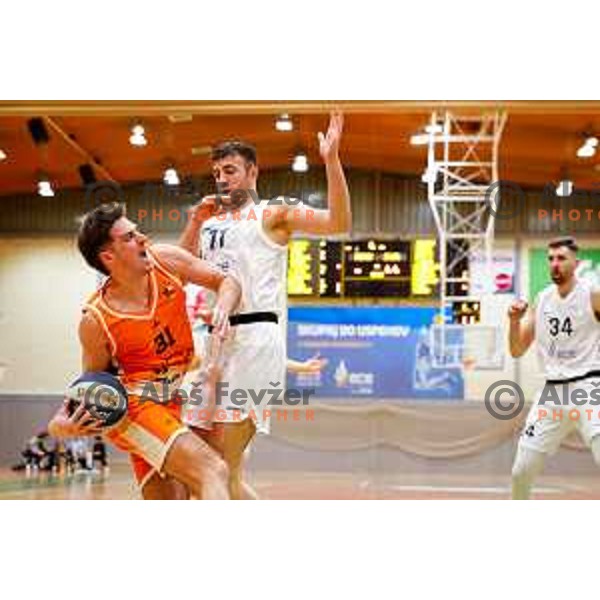 Lenart Sirc and Uros Sikanic in action during OTP Bank League basketball match between Triglav and Kansai Helios in Planina Hall, Kranj, Slovenia on December 6, 2025
