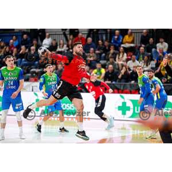 Matic Suholeznik of RD LL Grosist Slovan in action during 1.NLB handball match between LL Grosist Slovan and RK Celje PL in Kodeljevo Hall, Ljubljana, Slovenia on December 13th, 2025.