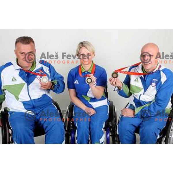 Joze Flere (left), Mateja Pintar (middle), Franc Pinter (right) of Slovenia Paraolympic team showing medals from Paraolympic Games in Beijing, China, september 2008. 