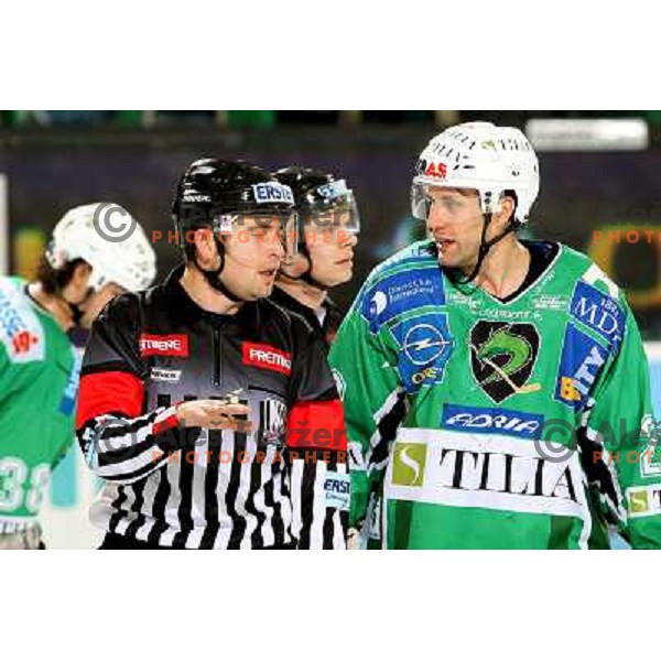 Greg Kuznik talks to a referee at ice hockey match Tilia Olimpija-Graz 99ers in round 33 of EBEL league, played in Hala Tivoli, Ljubljana 14.12.2008 